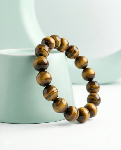 Natural Tiger Eye beaded bracelet featuring 8mm golden-brown chatoyant stones on white background.