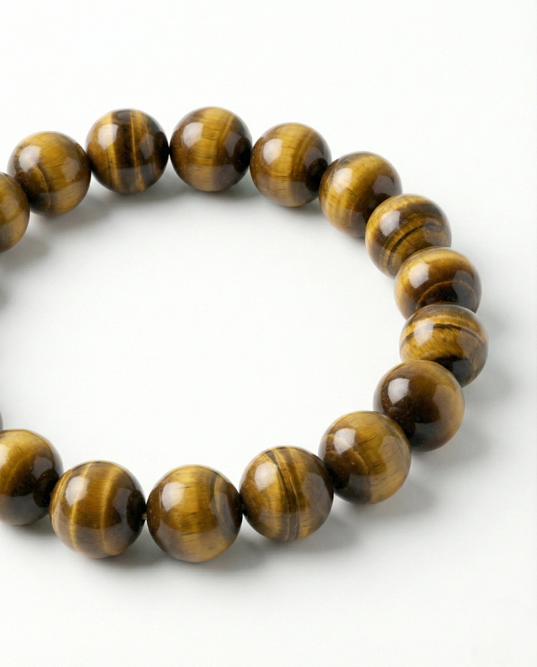 Natural Tiger Eye beaded bracelet featuring 8mm golden-brown chatoyant stones on white background.