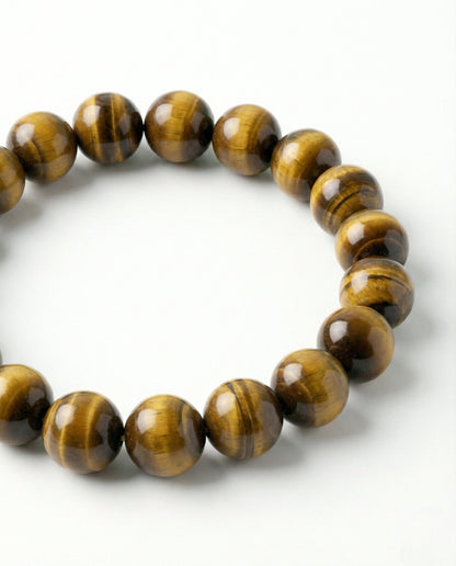 Natural Tiger Eye beaded bracelet featuring 8mm golden-brown chatoyant stones on white background.