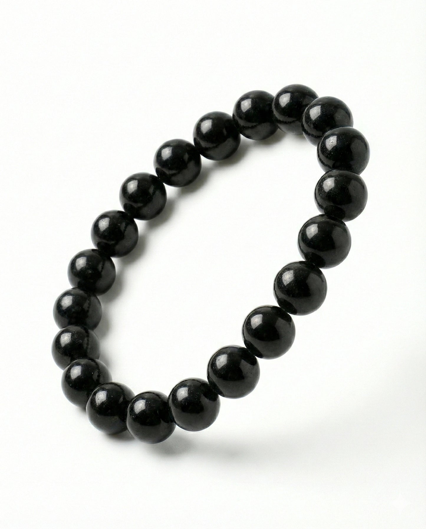 Natural Black Obsidian beaded bracelet featuring shiny 8mm black stones on white background.