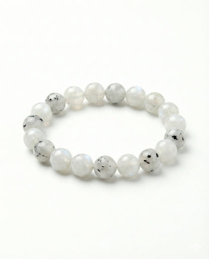 Natural Rainbow Moonstone beaded bracelet featuring 8mm white stones with black tourmaline inclusions on white background.
