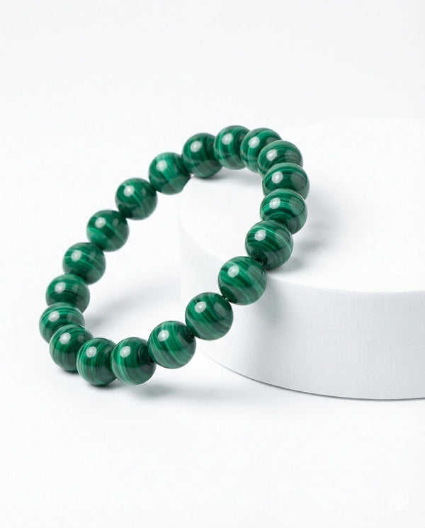Natural Malachite beaded bracelet featuring 8mm green banded stones on white background.