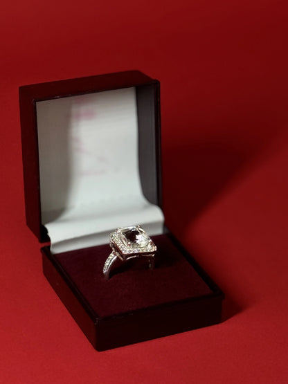 Large rectangular Clear Quartz gemstone ring with halo setting in 925 sterling silver on black background