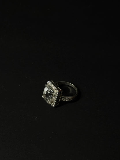 Large rectangular Clear Quartz gemstone ring with halo setting in 925 sterling silver on black background